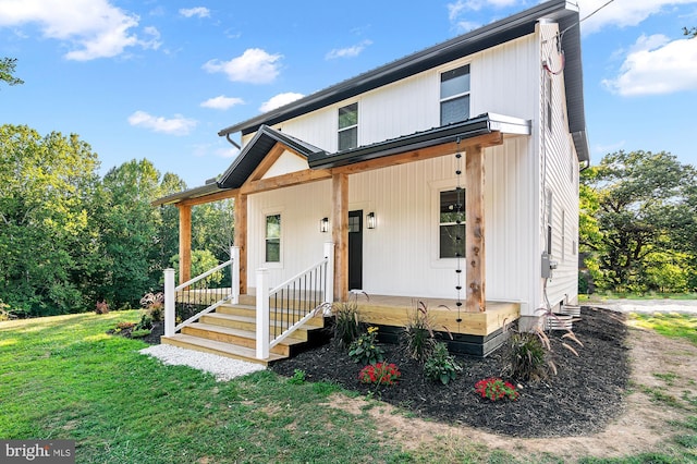 view of front of home featuring a front lawn and a porch