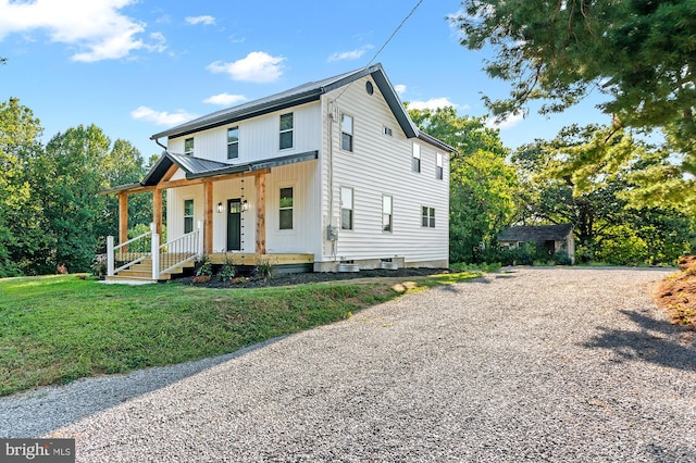 modern farmhouse featuring central AC, a front lawn, and covered porch