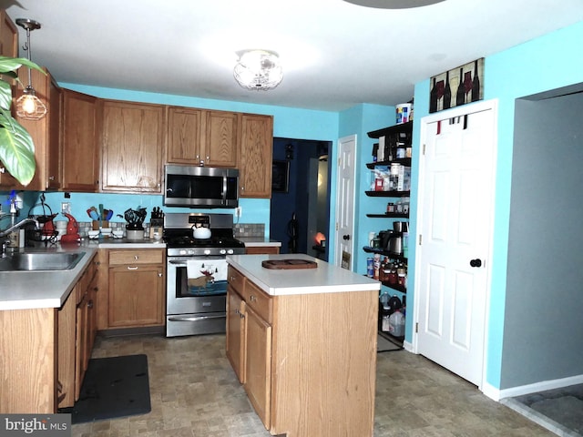 kitchen featuring stainless steel appliances, sink, and a kitchen island