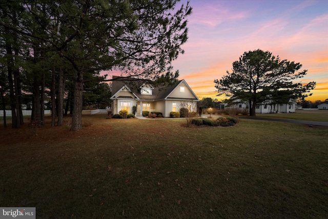 view of front of home featuring a lawn