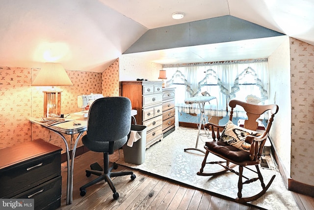 office with hardwood / wood-style flooring and vaulted ceiling