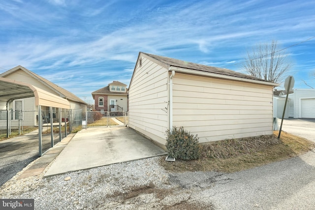 view of property exterior featuring a carport