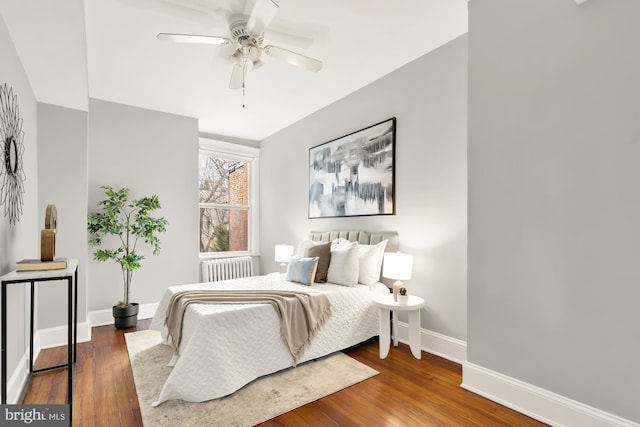 bedroom with baseboards, ceiling fan, dark wood finished floors, and radiator