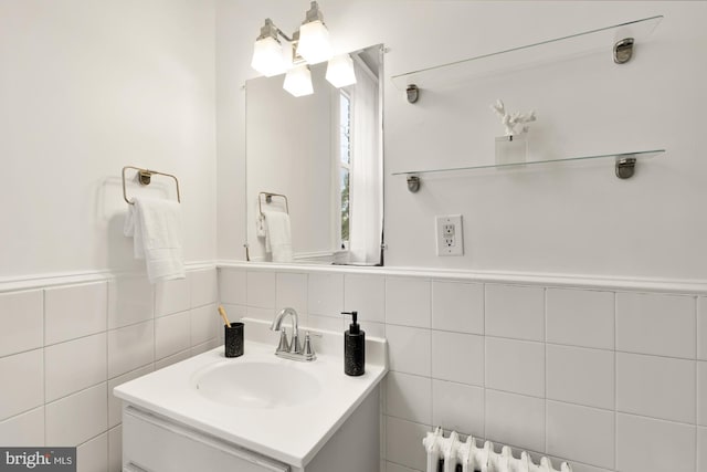 bathroom with tile walls and vanity