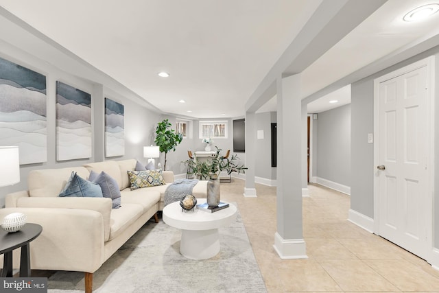 living room featuring recessed lighting, baseboards, and light tile patterned floors