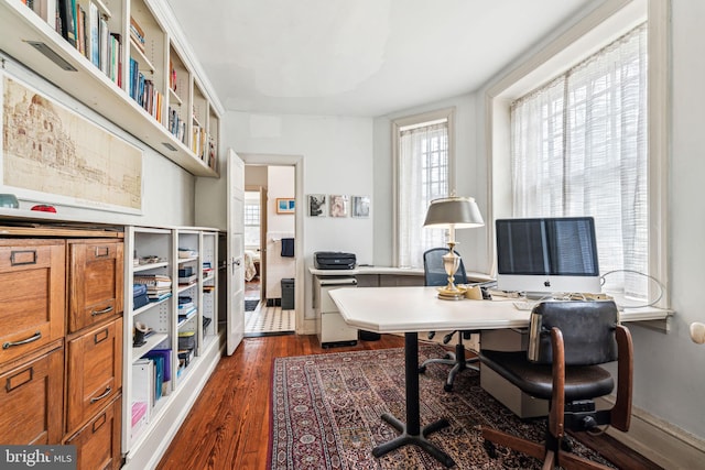 office featuring dark wood-style flooring and baseboards