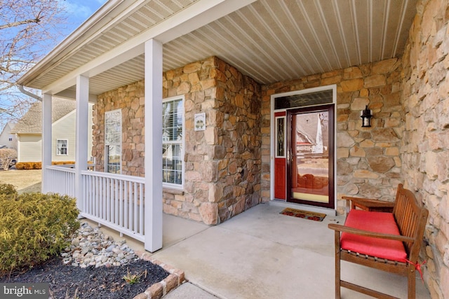 doorway to property featuring a porch