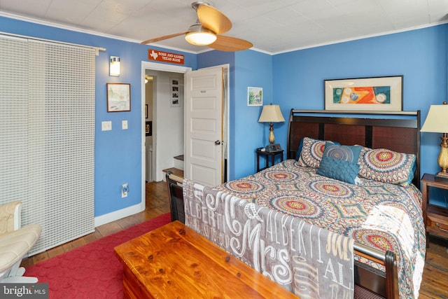 bedroom featuring ornamental molding, wood-type flooring, and ceiling fan