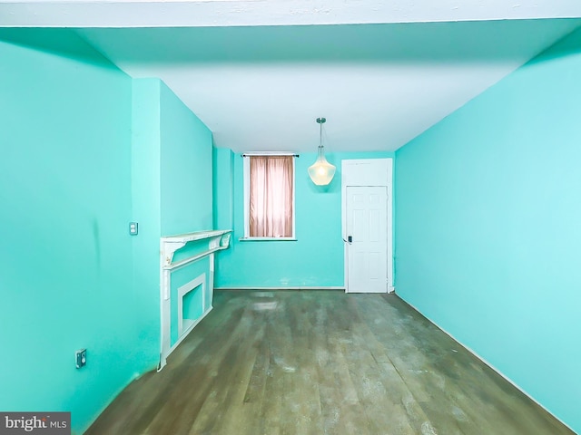 unfurnished dining area featuring wood finished floors