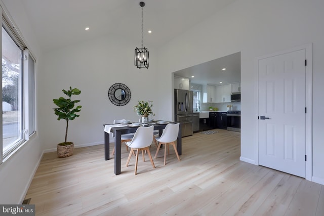 dining space featuring light wood-type flooring and plenty of natural light