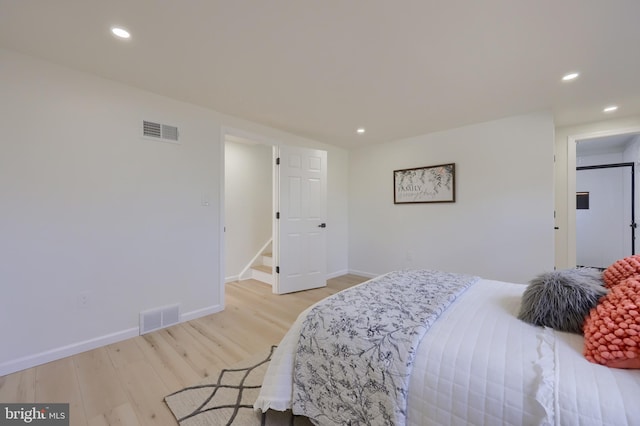 bedroom featuring recessed lighting, baseboards, visible vents, and light wood finished floors