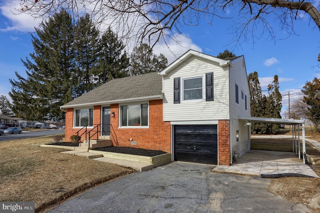 tri-level home with brick siding, a carport, a shingled roof, crawl space, and a garage