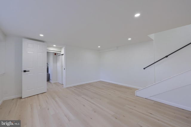 interior space with light wood-style floors, recessed lighting, and baseboards