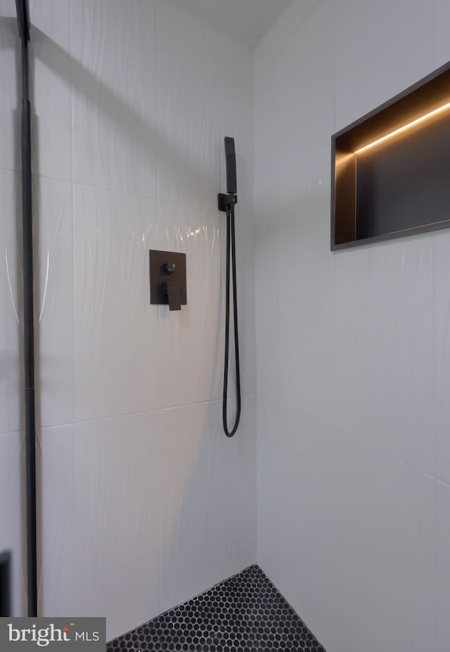 interior space with tiled shower