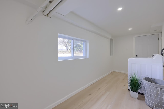 laundry area featuring recessed lighting, laundry area, light wood-style flooring, and baseboards