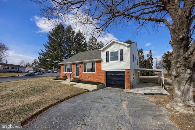 tri-level home with an attached garage, crawl space, aphalt driveway, and brick siding