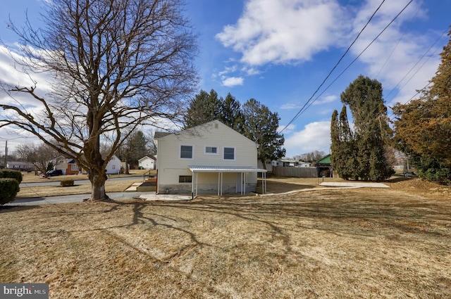 view of property exterior with a yard