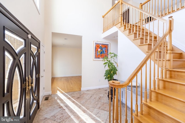 entryway featuring a high ceiling