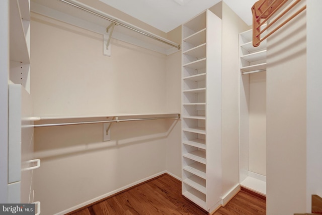 spacious closet with wood finished floors