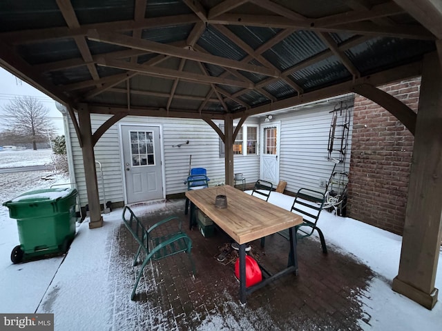 snow covered patio featuring a gazebo