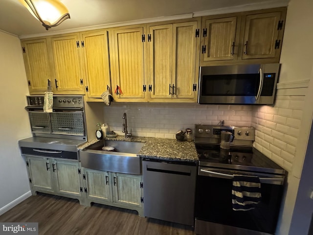 kitchen with dark wood-type flooring, sink, dark stone countertops, appliances with stainless steel finishes, and backsplash