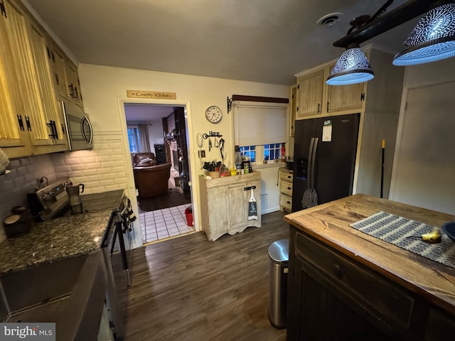 kitchen with stainless steel appliances, decorative backsplash, dark hardwood / wood-style flooring, and decorative light fixtures