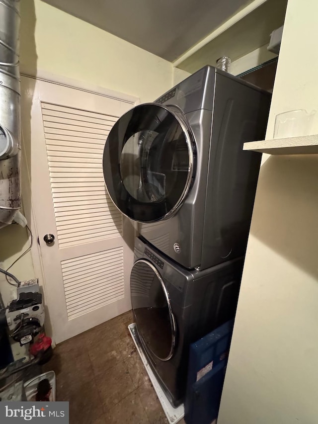 laundry room featuring stacked washing maching and dryer