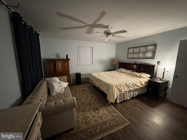 bedroom with ceiling fan and dark hardwood / wood-style flooring