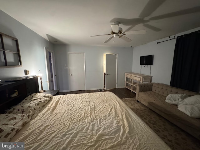 bedroom with dark wood-type flooring and ceiling fan