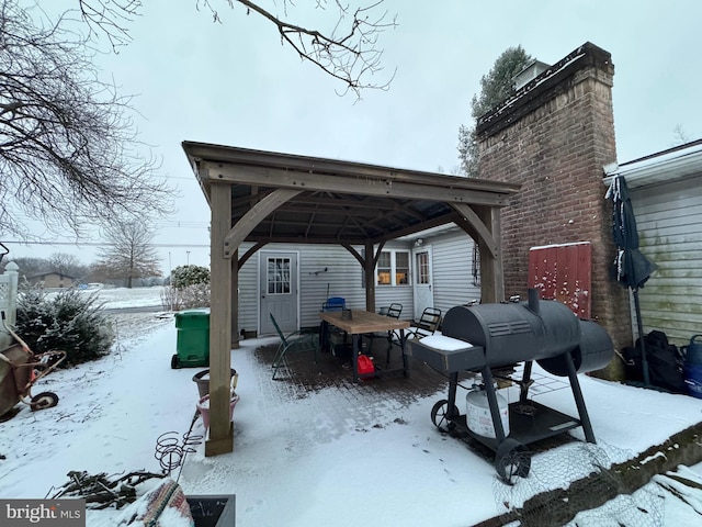 snow covered parking with a gazebo