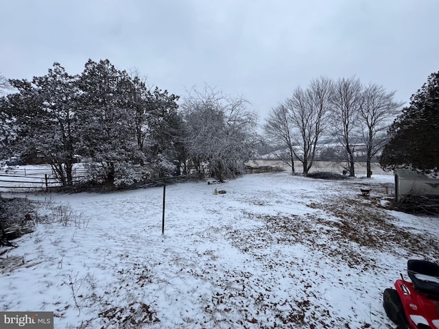 view of yard layered in snow