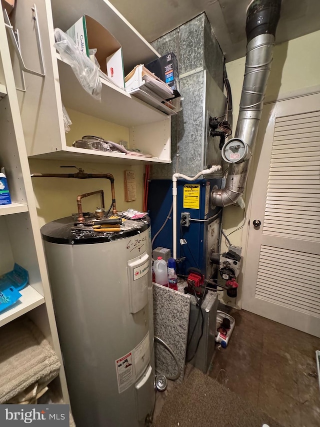 utility room featuring electric water heater