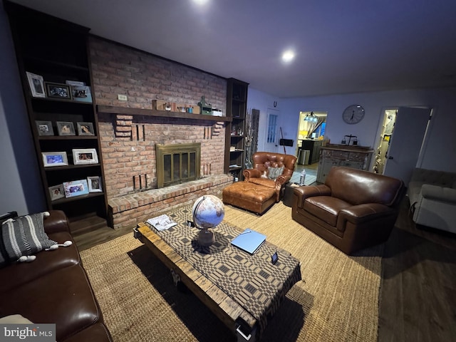 living room featuring hardwood / wood-style flooring and a fireplace