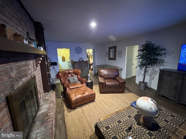 living room featuring hardwood / wood-style floors and a fireplace