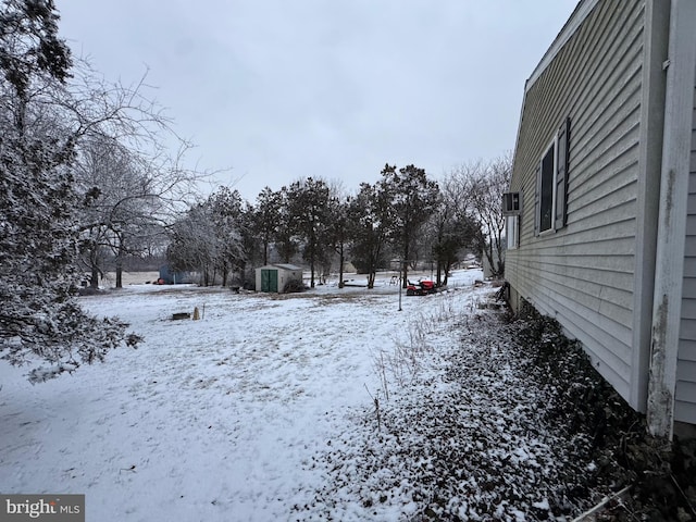 view of yard layered in snow