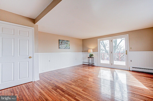 interior space with light hardwood / wood-style floors and a baseboard radiator