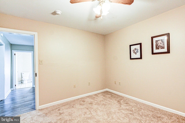 carpeted empty room with ceiling fan