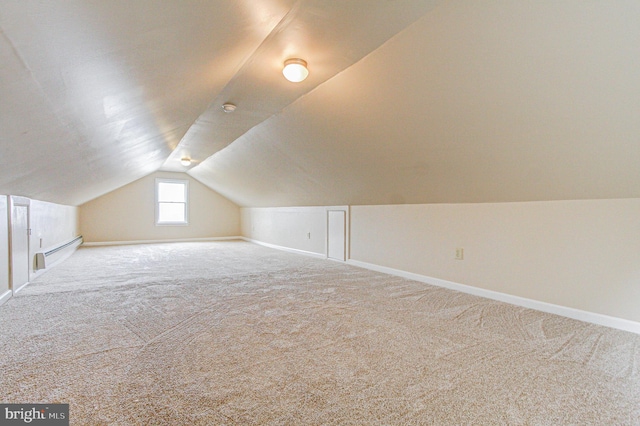 bonus room featuring light carpet, baseboard heating, and lofted ceiling