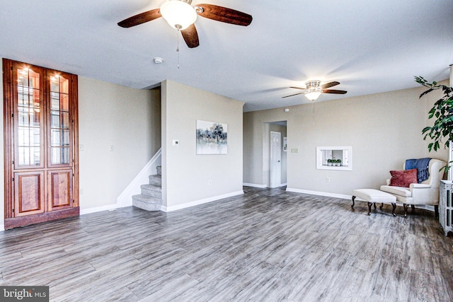 unfurnished room featuring hardwood / wood-style flooring and ceiling fan