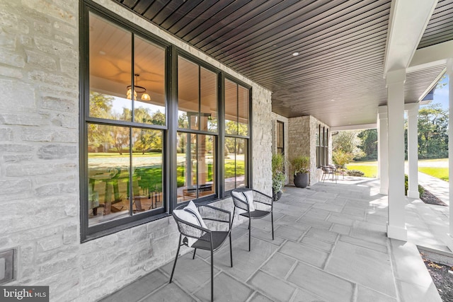 view of patio featuring a porch