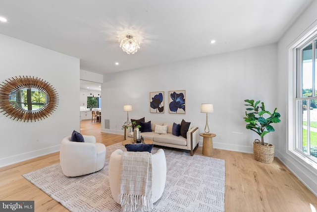 living room featuring plenty of natural light and light wood-type flooring