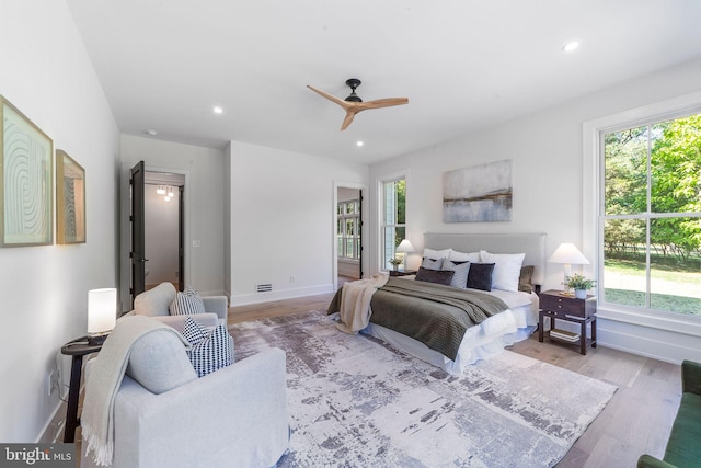 bedroom featuring ceiling fan and light wood-type flooring