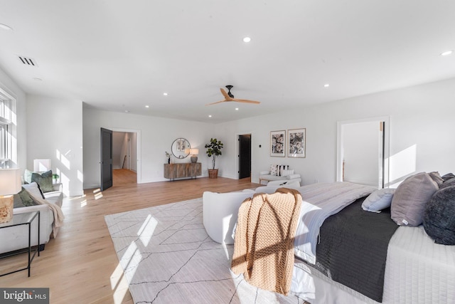 bedroom featuring ceiling fan and light hardwood / wood-style flooring