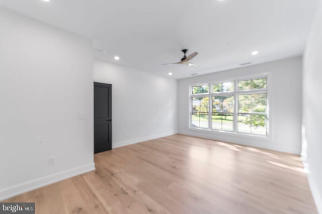 spare room with ceiling fan and light hardwood / wood-style flooring