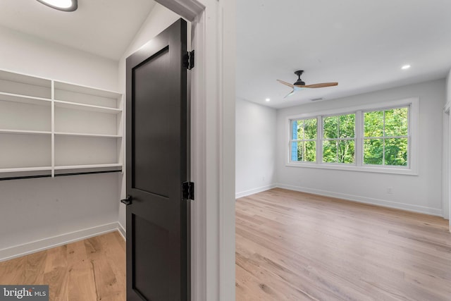 interior space with light hardwood / wood-style flooring and ceiling fan