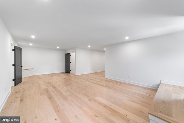 unfurnished living room featuring light wood-type flooring