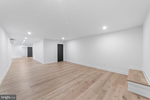 empty room with light hardwood / wood-style floors