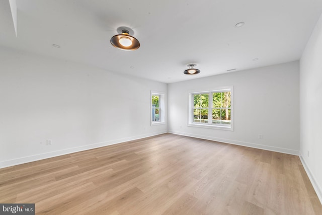 unfurnished room featuring light hardwood / wood-style floors