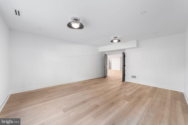 unfurnished room with light hardwood / wood-style floors