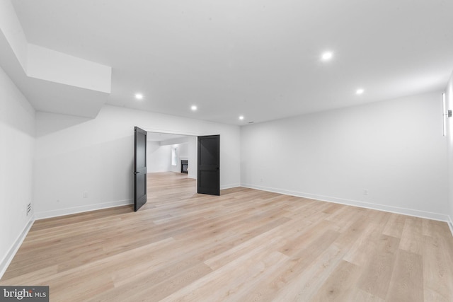 basement with light wood-type flooring